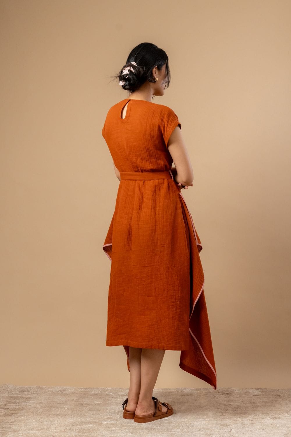 Doodlage Bessie knot dress in earthy fabric featuring a stylish knot detail and flowing silhouette.
