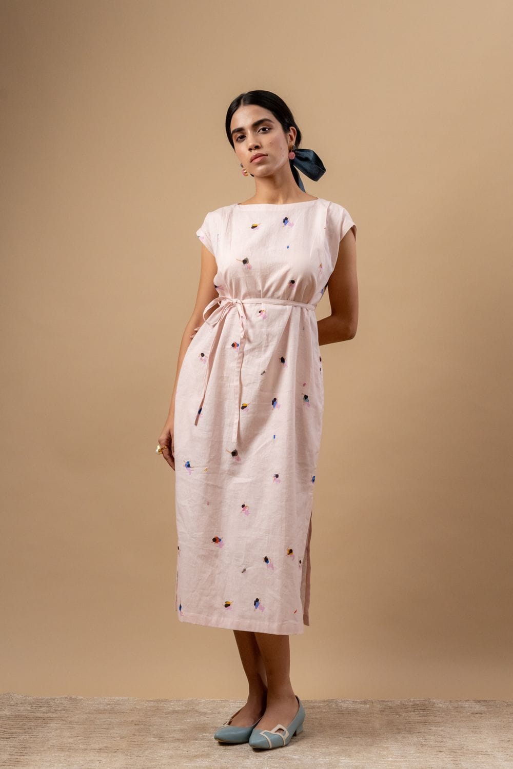 Doodlage Erna printed dress with floral pattern, knee-length, lightweight fabric, and short sleeves, displayed on a hanger.