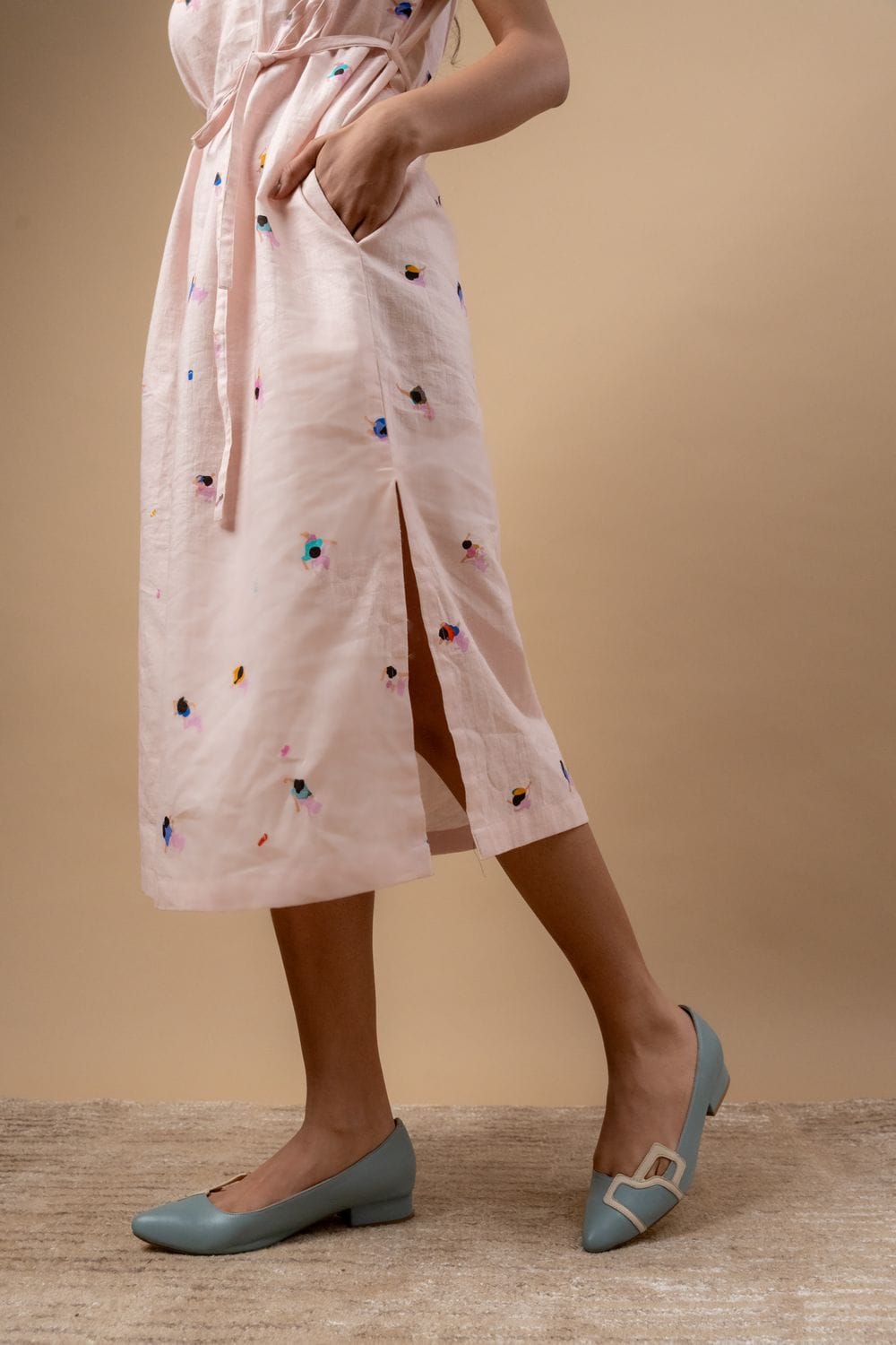 Doodlage Erna printed dress with colorful floral pattern, short sleeves, and knee-length design on a model.