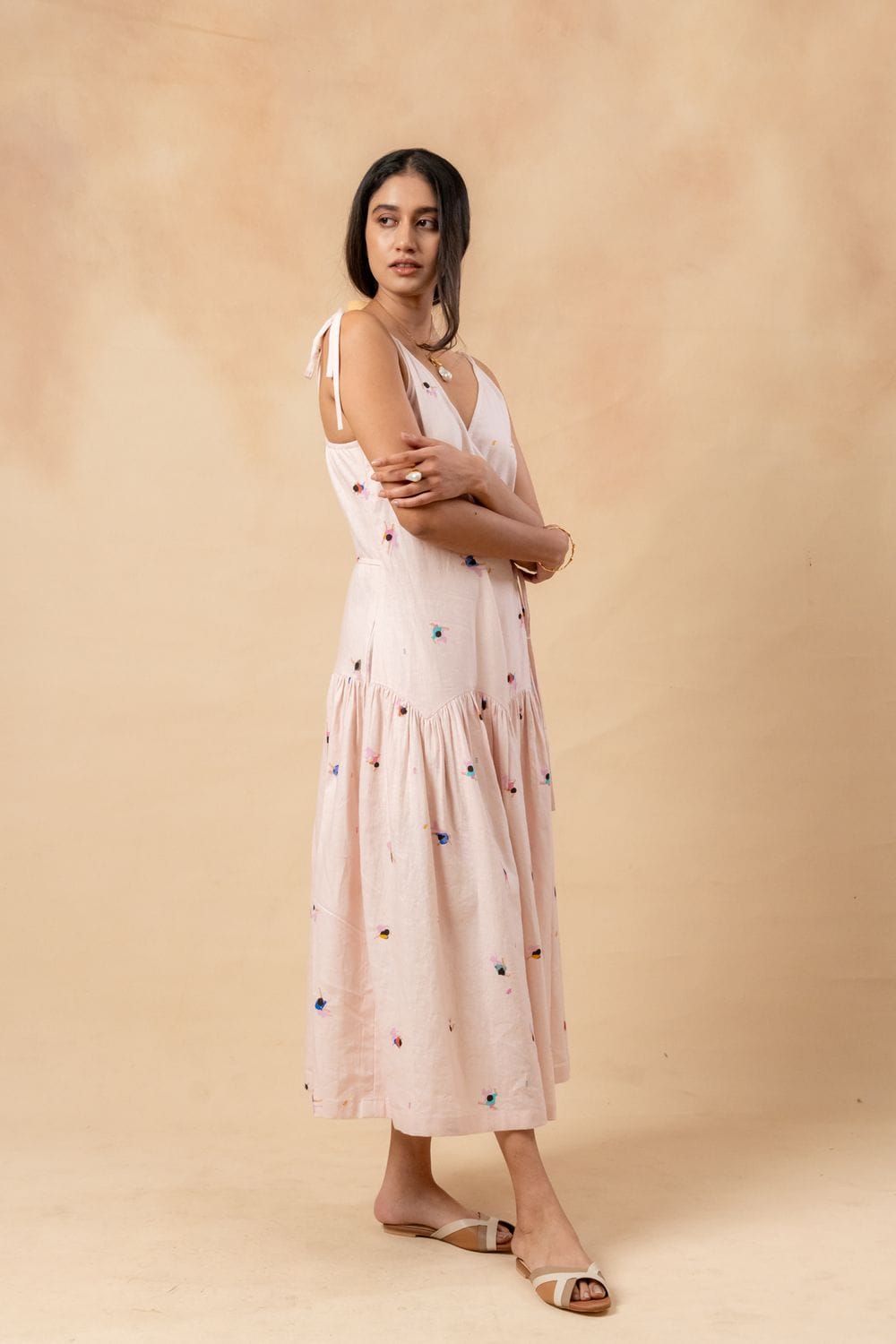 Doodlage crayon wrap dress with long sleeves and knee-length design, featuring colorful crayon print fabric.