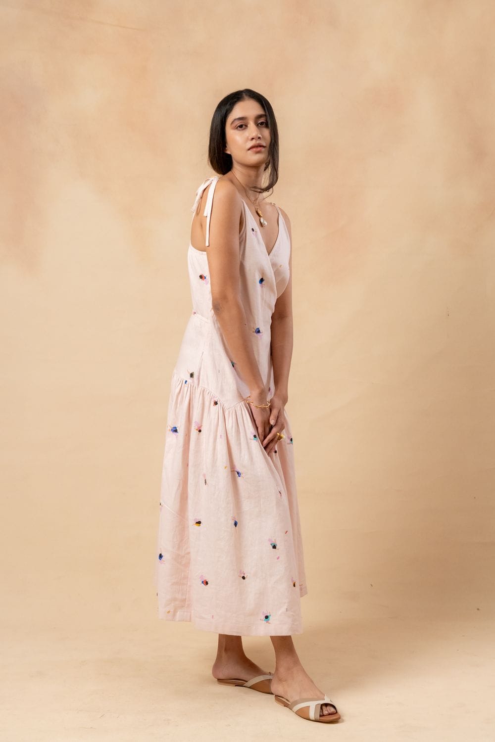 Doodlage crayon wrap dress in vibrant multicolor fabric, stylish and comfortable for casual or semi-formal occasions.