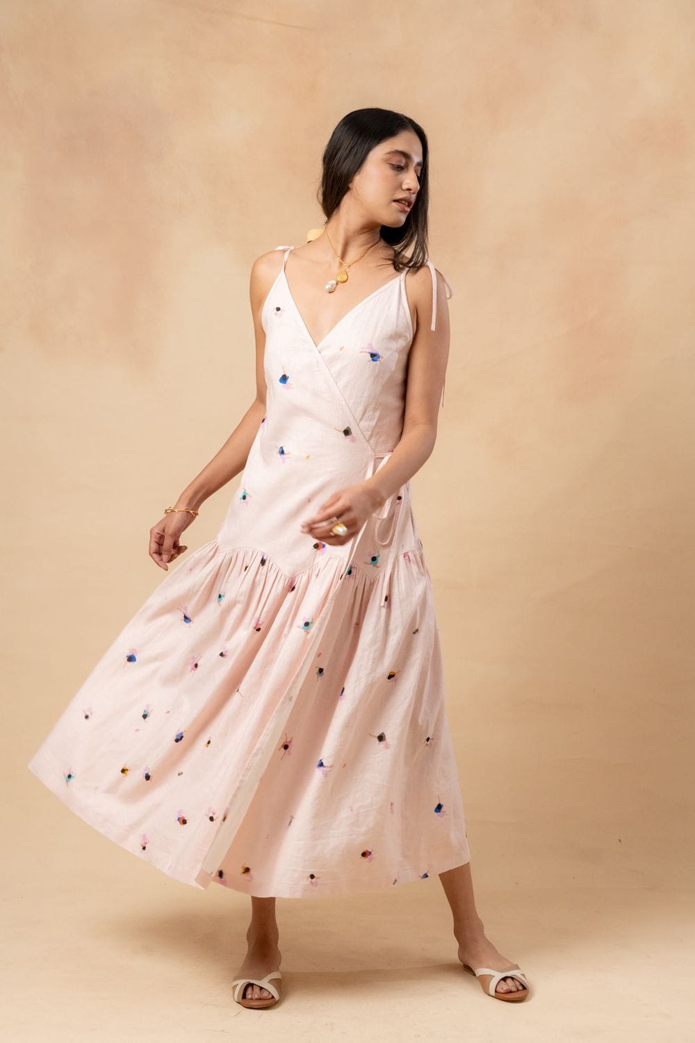 Doodlage crayon wrap dress in vibrant fabric with a fitted waist and flowing skirt, stylish and comfortable for casual wear.