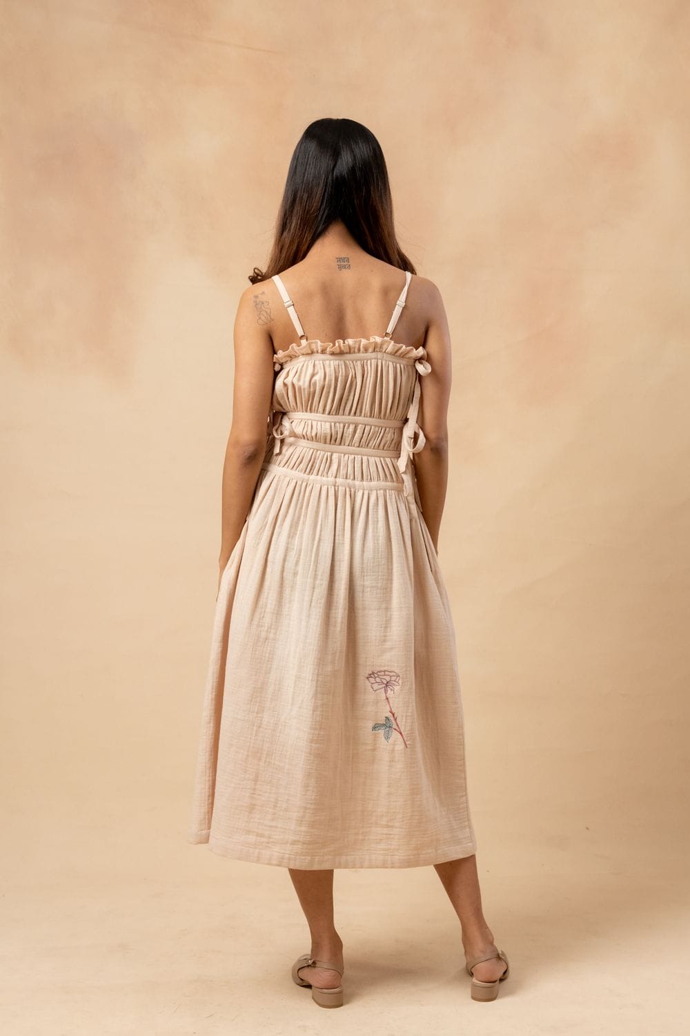 Doodlage Kiteberry dress displayed on a hanger, featuring a stylish, patterned fabric and a modern, casual silhouette.