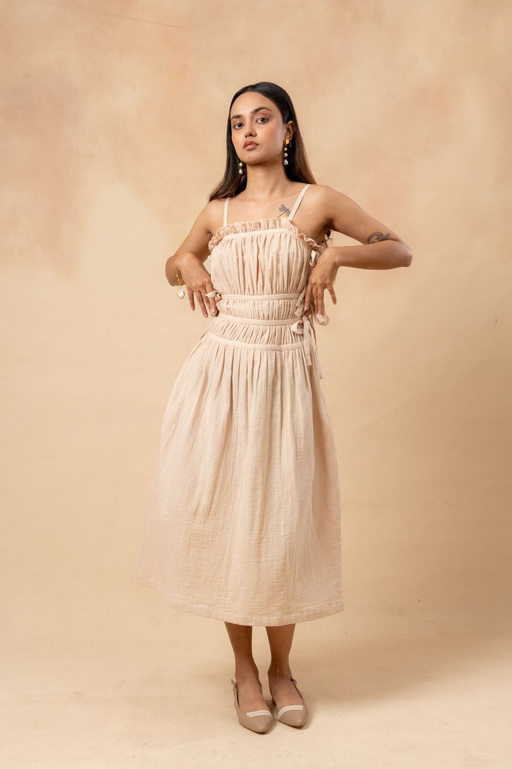 Doodlage Kiteberry dress with colorful patterned fabric, sleeveless design, and knee-length cut, hanging on a hanger.