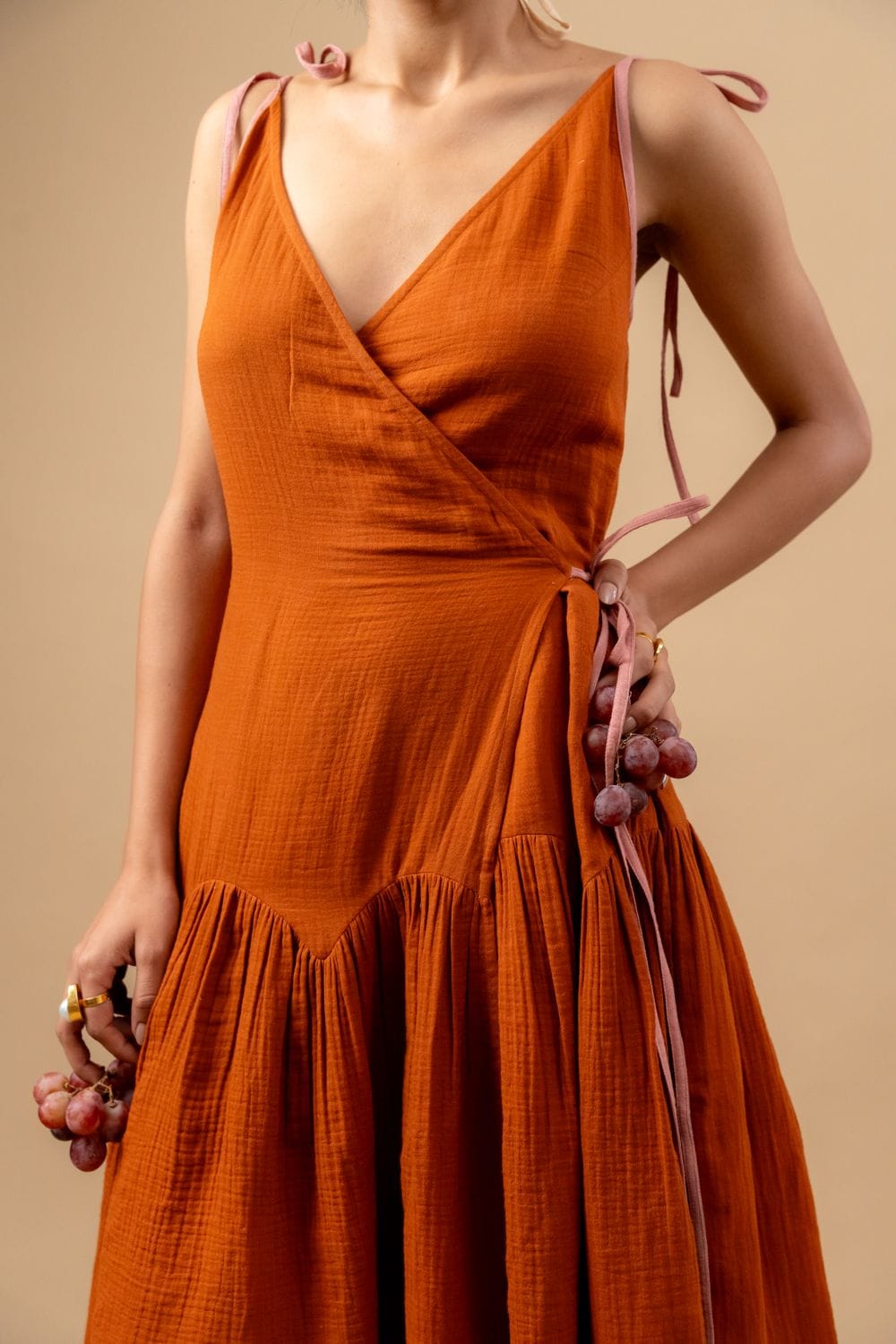 Doodlage Mudpie Maker dress in vibrant fabric with playful design, sleeveless style, ideal for casual or summer wear.