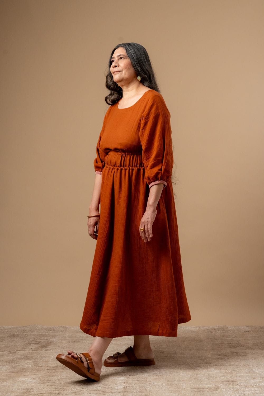 Doodlage Meadowmallow dress in soft fabric, featuring a flowy silhouette and floral print, displayed on a hanger.