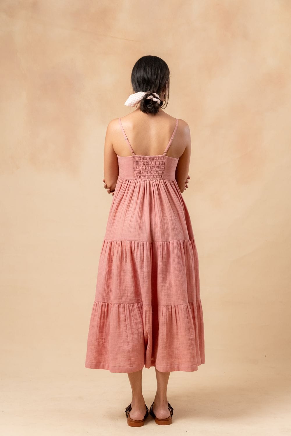 Doodlage Cloudberry Kiss Dress displayed on a hanger, showcasing its flowy fabric and intricate design details.
