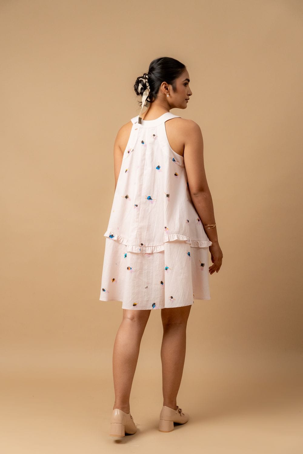 Doodlage Daisy Daze printed dress with floral pattern, sleeveless design, and lightweight fabric, displayed on a hanger.
