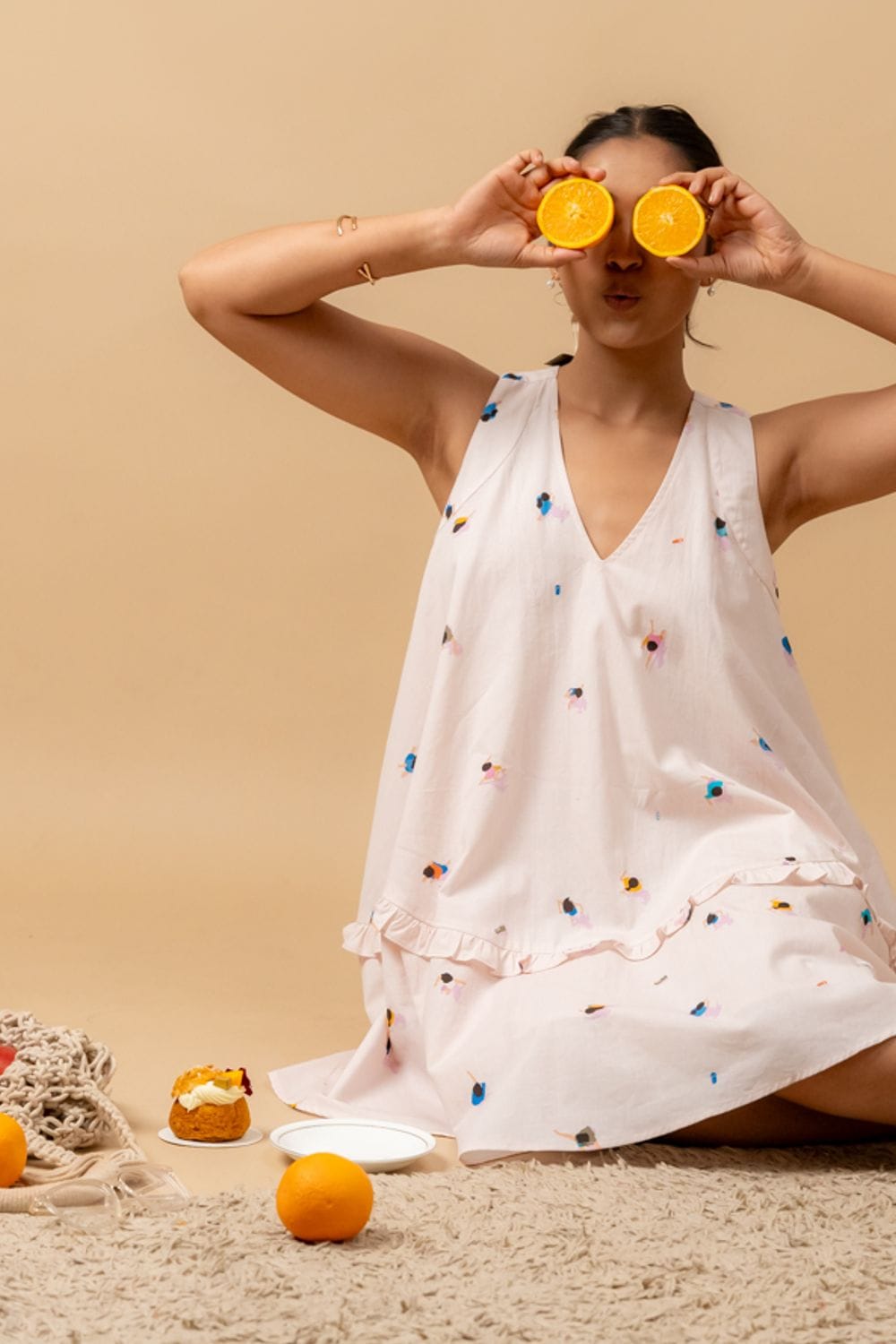 Doodlage Daisy Daze printed dress featuring floral patterns and a relaxed fit, displayed on a hanger against a plain background.