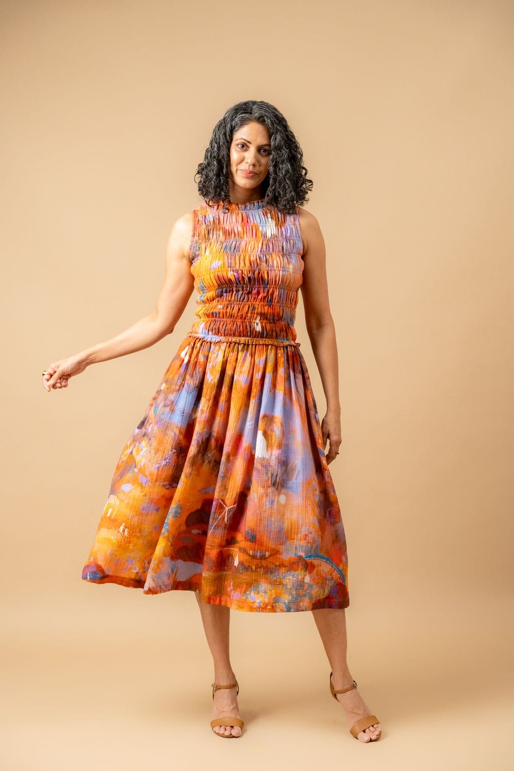 Doodlage Midsummer smocked dress in lightweight fabric with a fitted bodice and flowing skirt, perfect for warm weather.