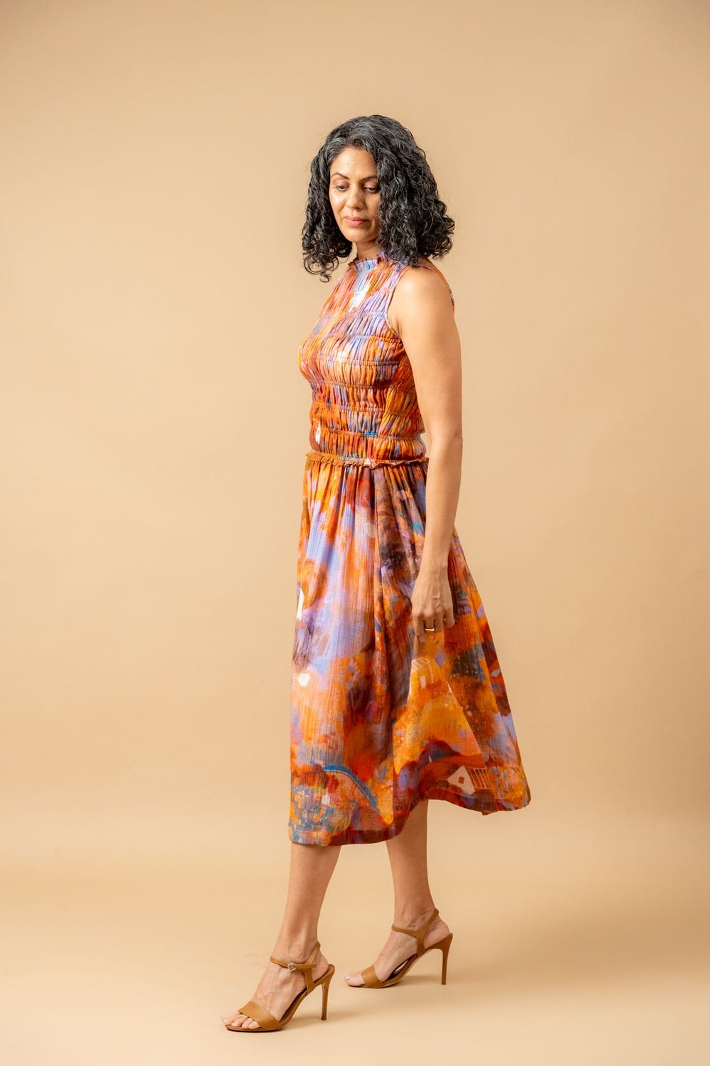 Doodlage Midsummer smocked dress in lightweight fabric with intricate smocking detail and a flowing silhouette.
