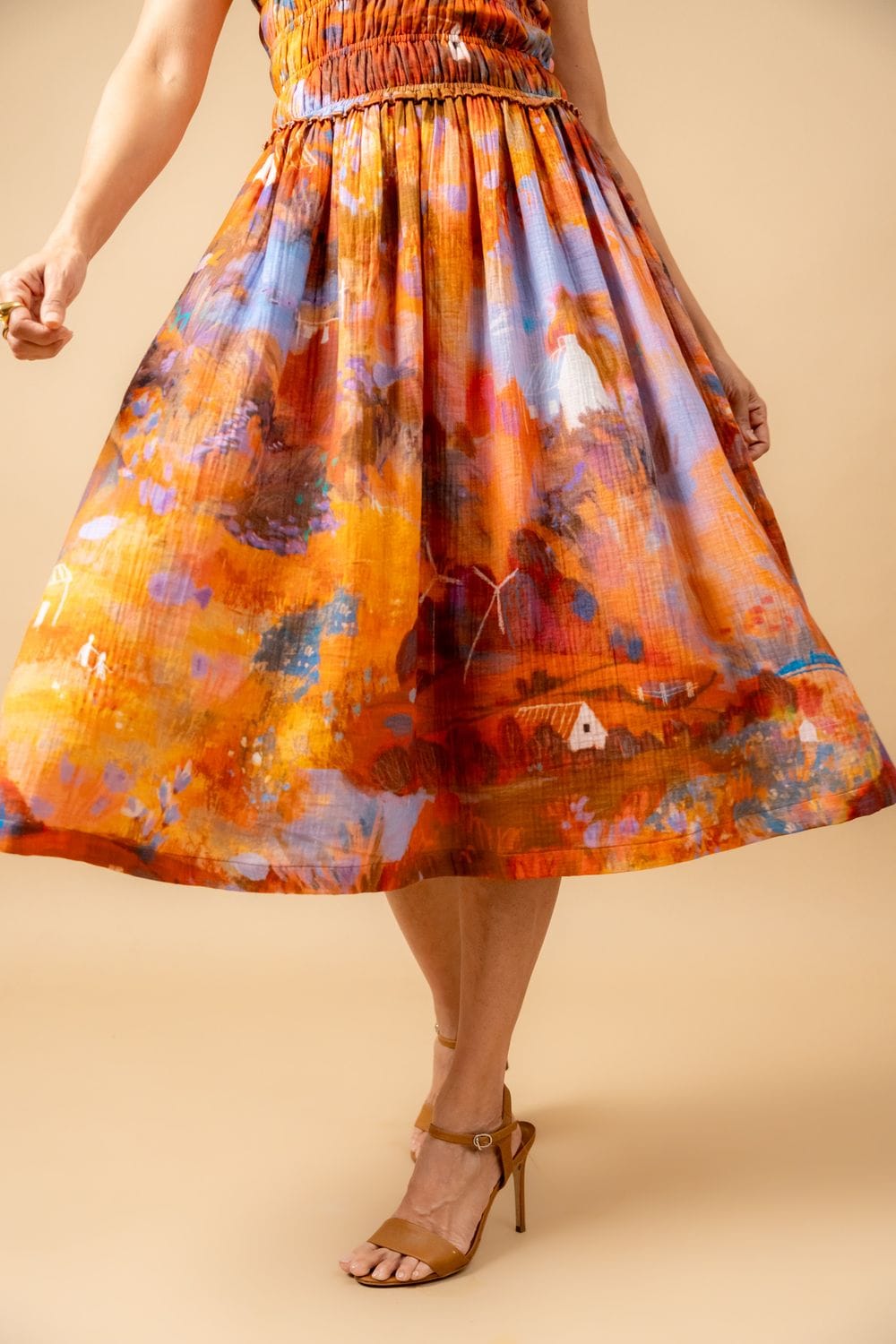 Midsummer smocked dress by Doodlage featuring a fitted bodice, flowy skirt, and delicate smocking details.