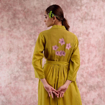 Doodlage Carolle embroidered dress in vibrant fabric, featuring detailed embroidery and a flowing silhouette.