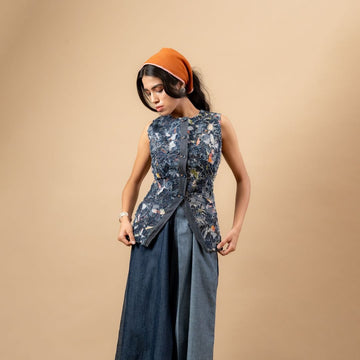 Upcycled denim waistcoat by Doodlage, featuring a stylish, eco-friendly design with button closure and patchwork details.