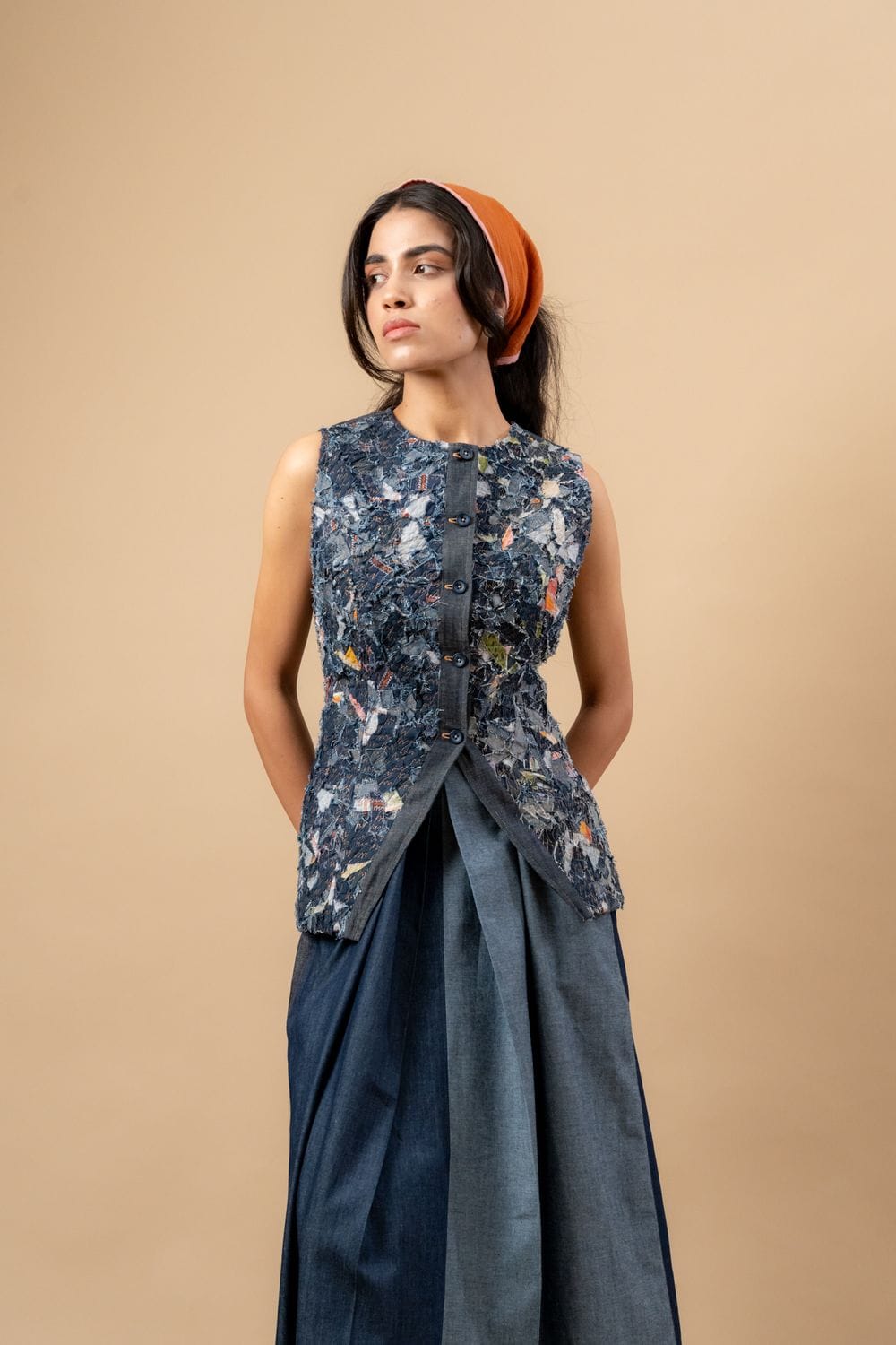 Upcycled denim waistcoat by Doodlage featuring a stylish, eco-friendly design with button closures and a fitted silhouette.