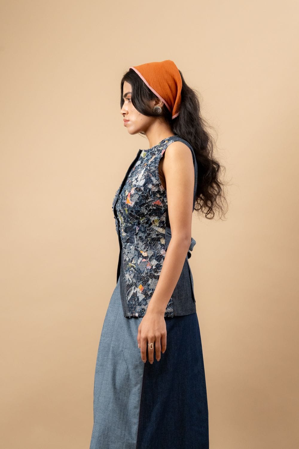 Upcycled denim waistcoat by Doodlage featuring a stylish, eco-friendly design with button closure and patchwork details.