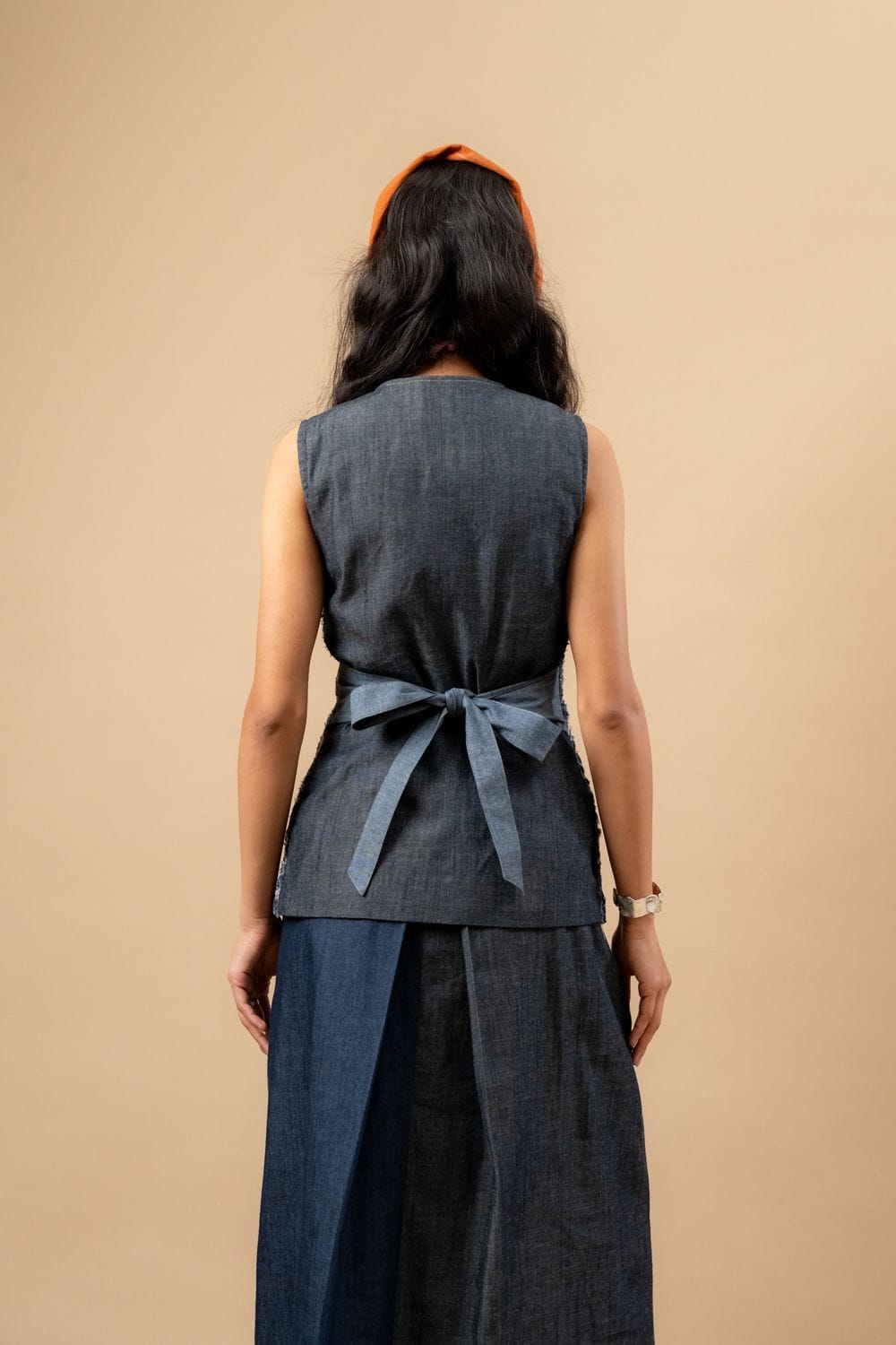 Upcycled denim waistcoat by Doodlage, featuring a stylish and sustainable design with button closure and sleeveless fit.