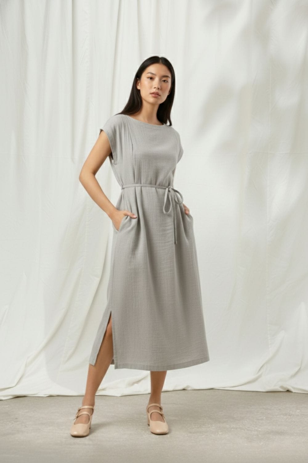 Doodlage Erna grey dress with long sleeves and a relaxed fit, shown on a hanger against a plain background.