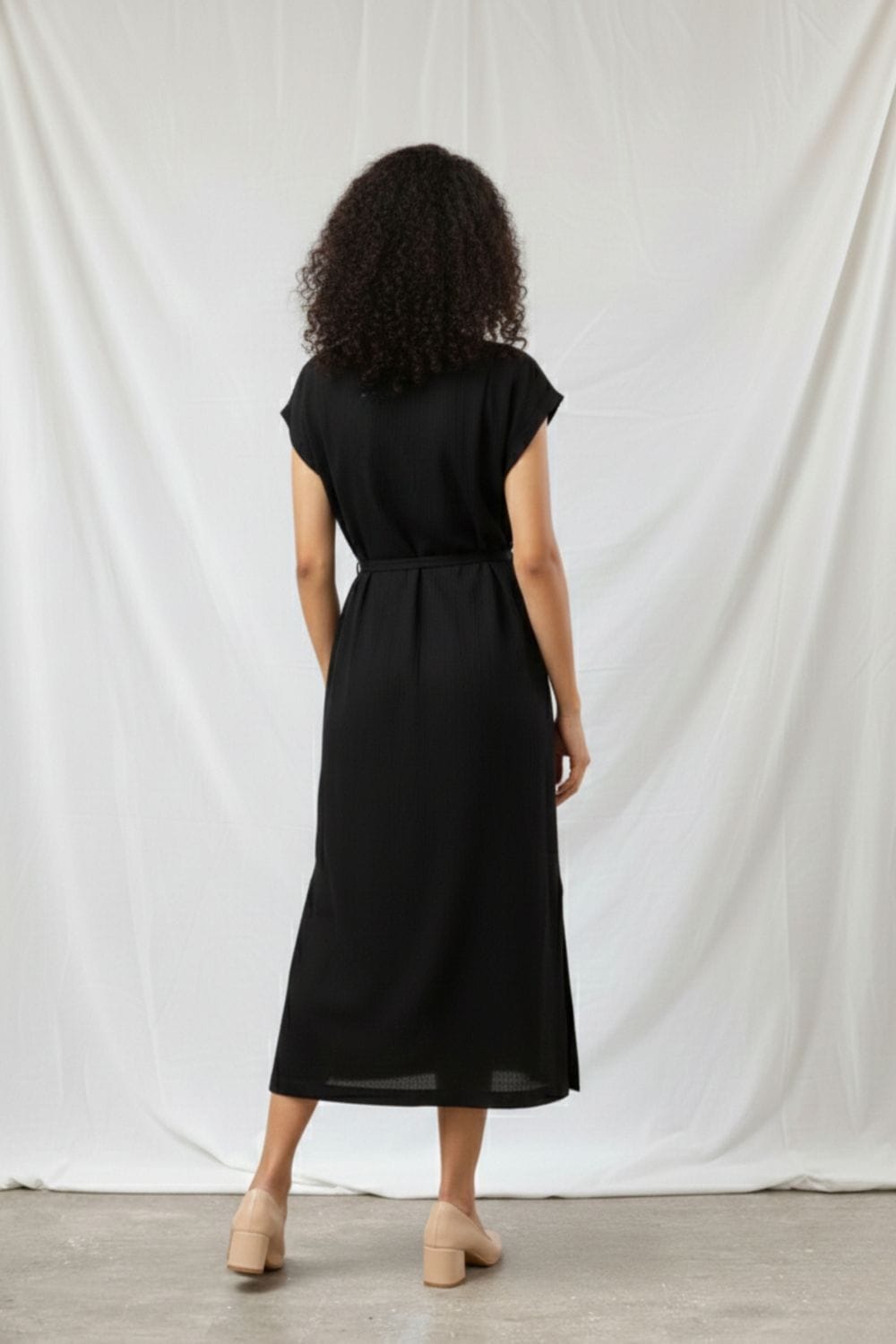 Black Erna dress by Doodlage featuring a stylish, fitted design with subtle detailing, perfect for casual or semi-formal wear.