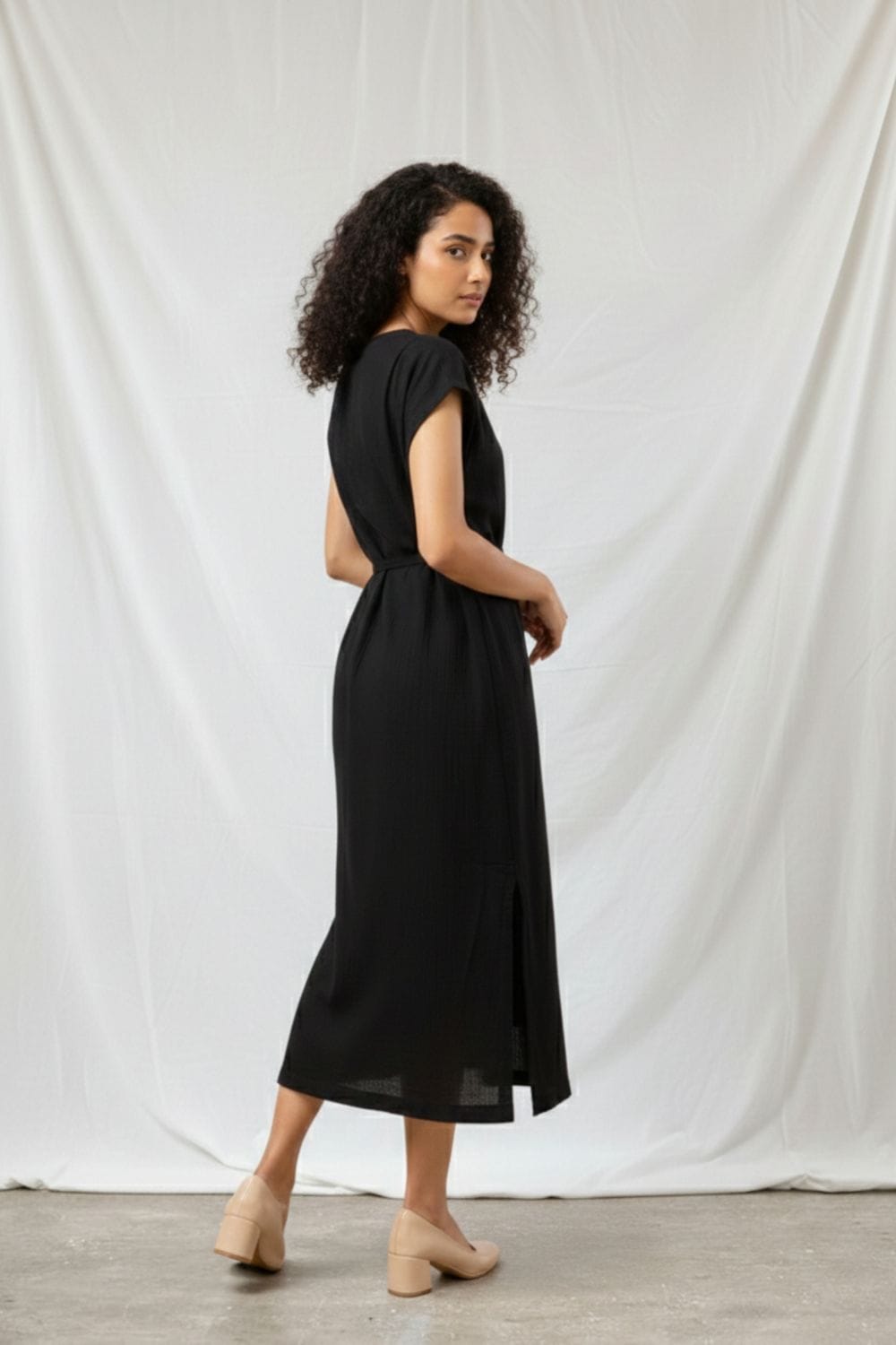 Black Erna dress by Doodlage, featuring a stylish, fitted design with elegant fabric details and a classic silhouette.