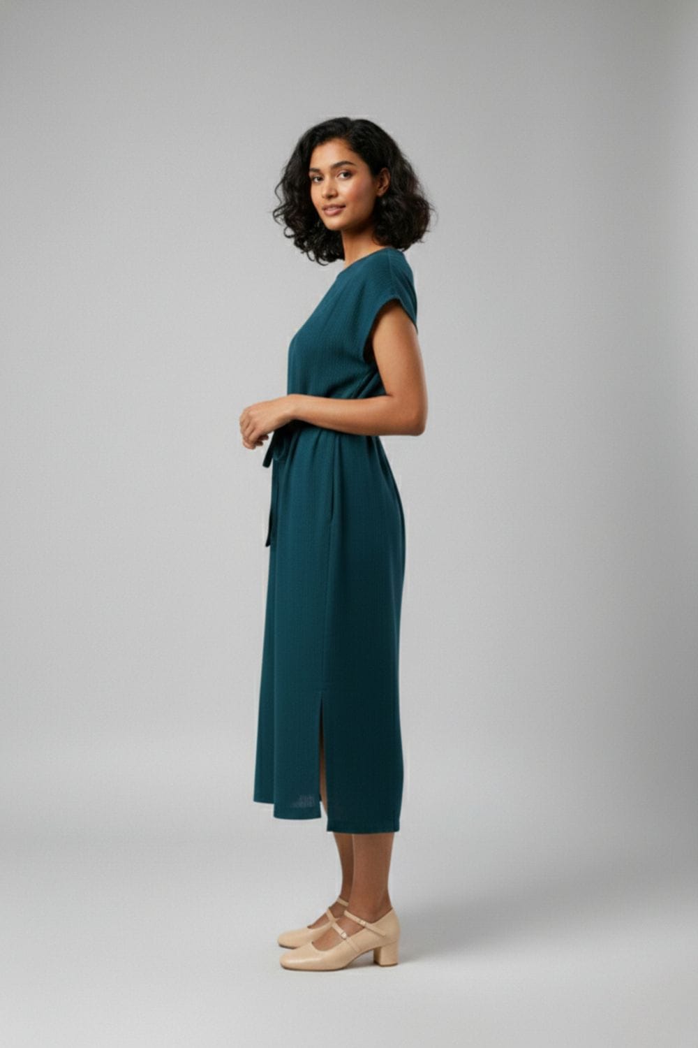 Doodlage Erna midnight blue dress with long sleeves and a flowing silhouette, displayed on a hanger against a neutral background.