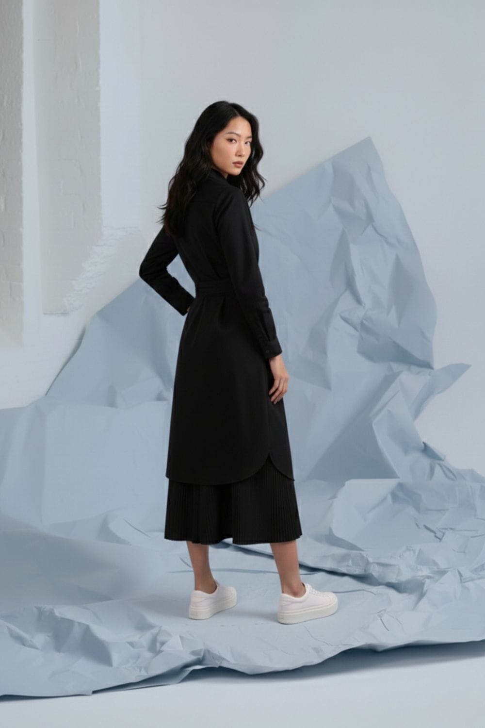 Doodlage Thea black shirt dress with long sleeves and collar, shown on a model with a relaxed fit and button-down front.