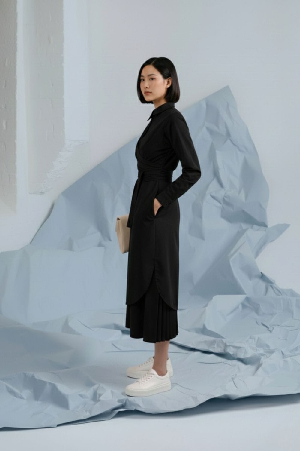 Black Thea shirt dress by Doodlage, featuring a collar, button-down front, and long sleeves, displayed on a hanger.