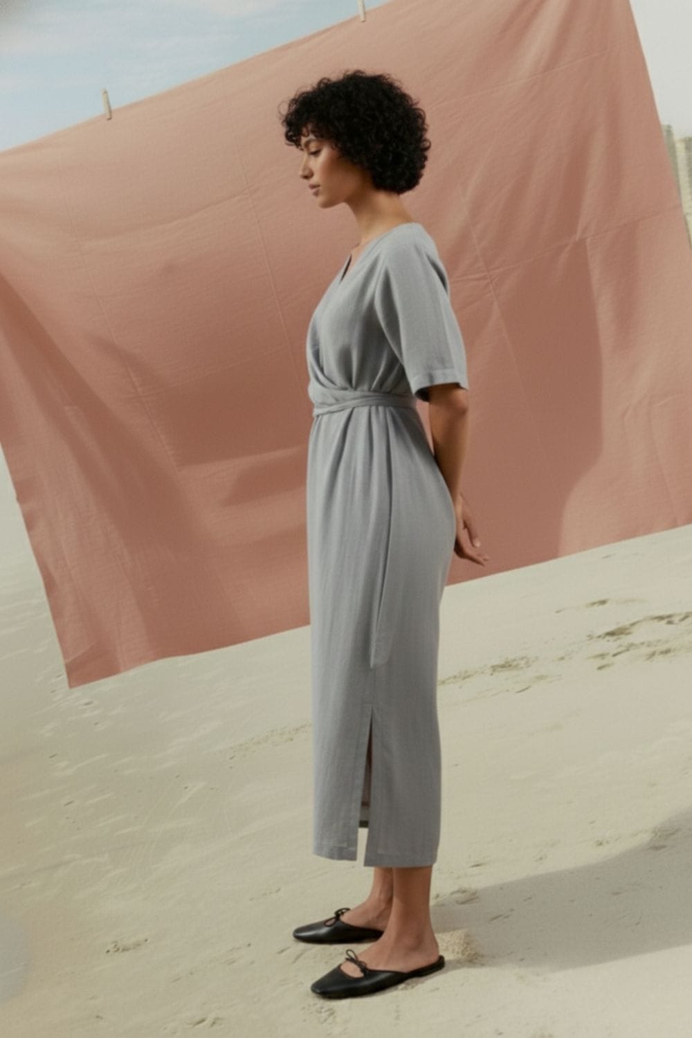 Doodlage Eden pale blue dress with flowing fabric and soft neckline, displayed on a hanger against a neutral background.