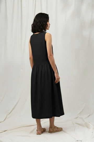 Black Susan dress by Doodlage, showcasing a stylish, fitted dress with elegant design and detailed fabric texture.