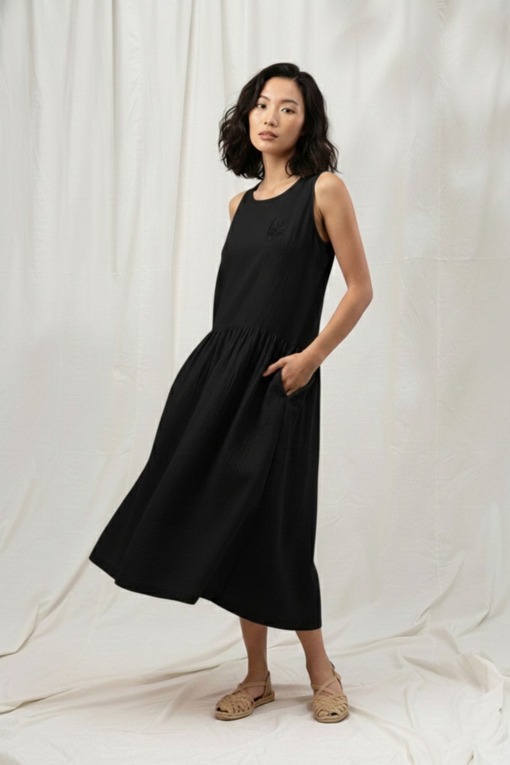 Black Doodlage Susan dress with a stylish silhouette, showcased on a model, perfect for elegant casual or evening wear.