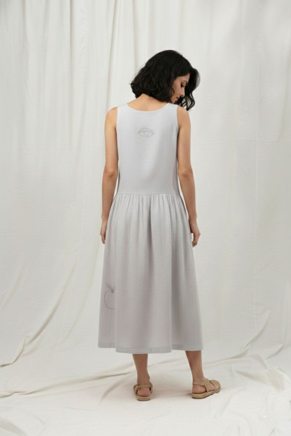 Susan grey dress by Doodlage, stylish casual dress with a relaxed fit and soft fabric, displayed on a hanger.