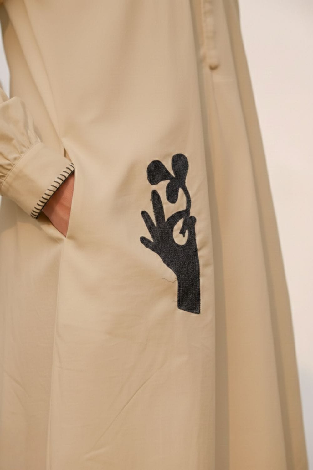 Astrid beige dress by Doodlage, sleeveless with a relaxed fit, showcasing its soft fabric and simple elegant design.