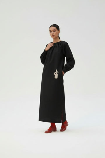 Black Astrid dress by Doodlage, featuring a stylish and comfortable design with elegant details, perfect for casual or semi-formal wear.