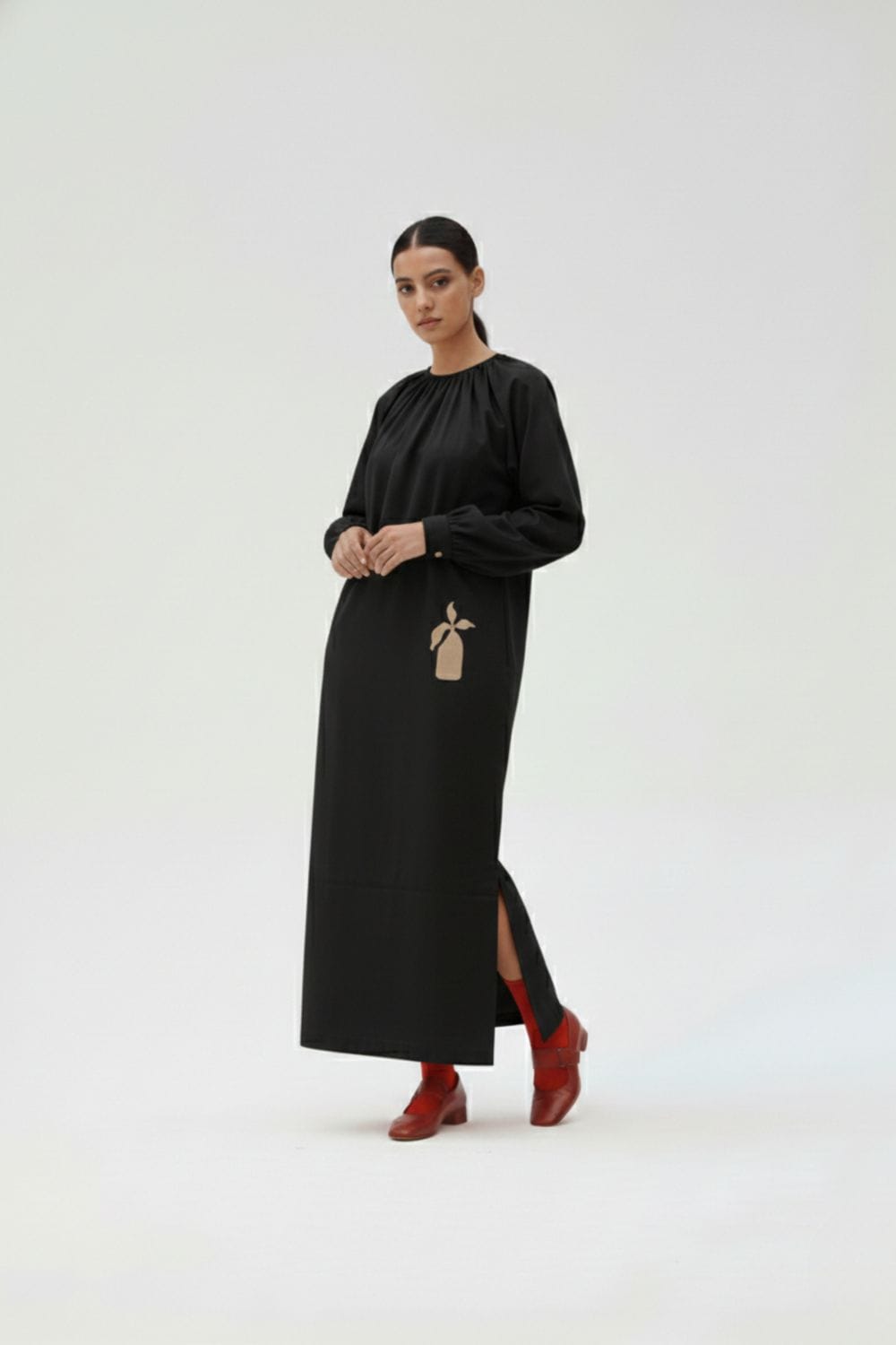 Black Astrid dress by Doodlage, showcasing a stylish women's dress with a fitted silhouette and elegant design.