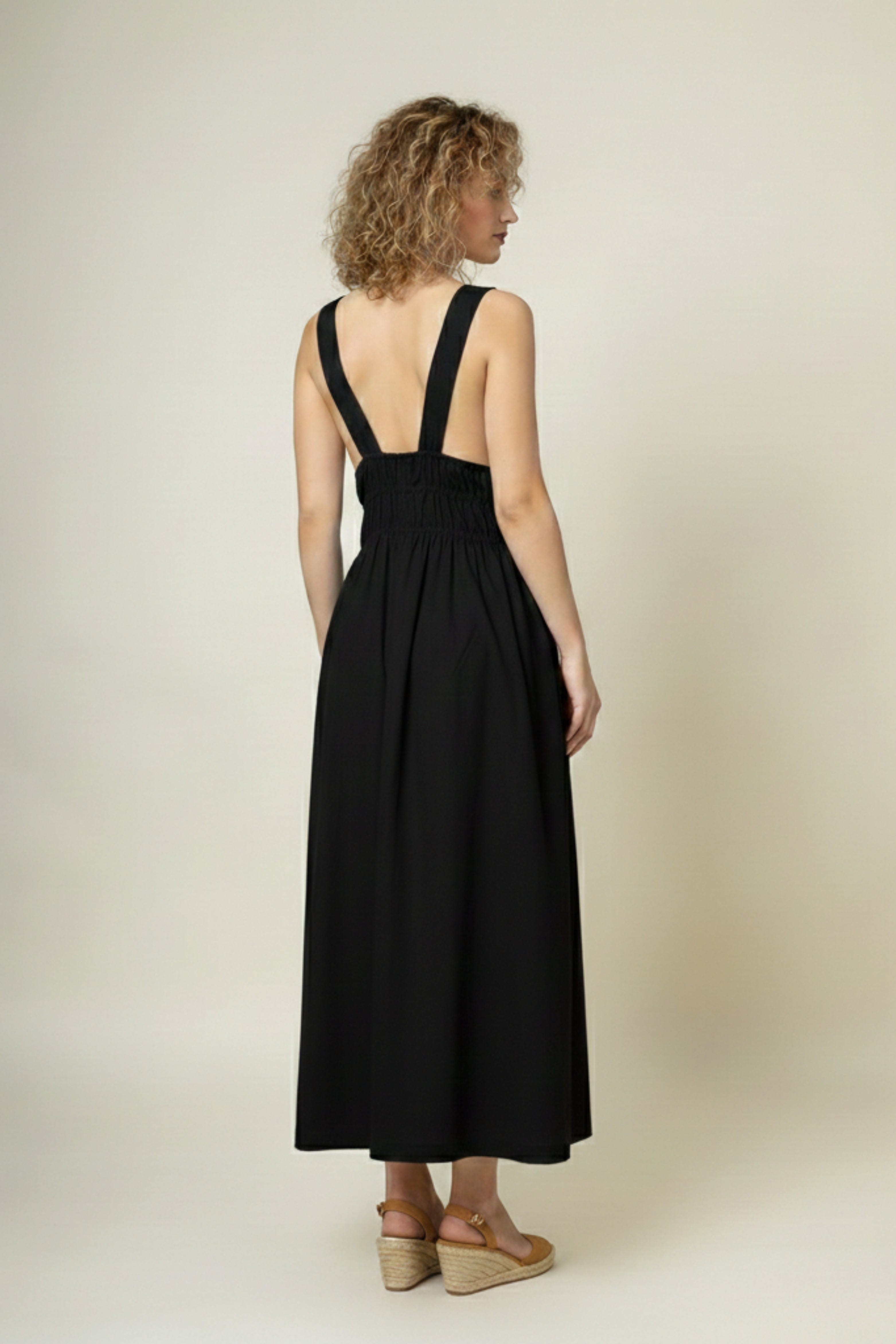 Black Doodlage August dress with a fitted silhouette, featuring elegant fabric and subtle detailing.