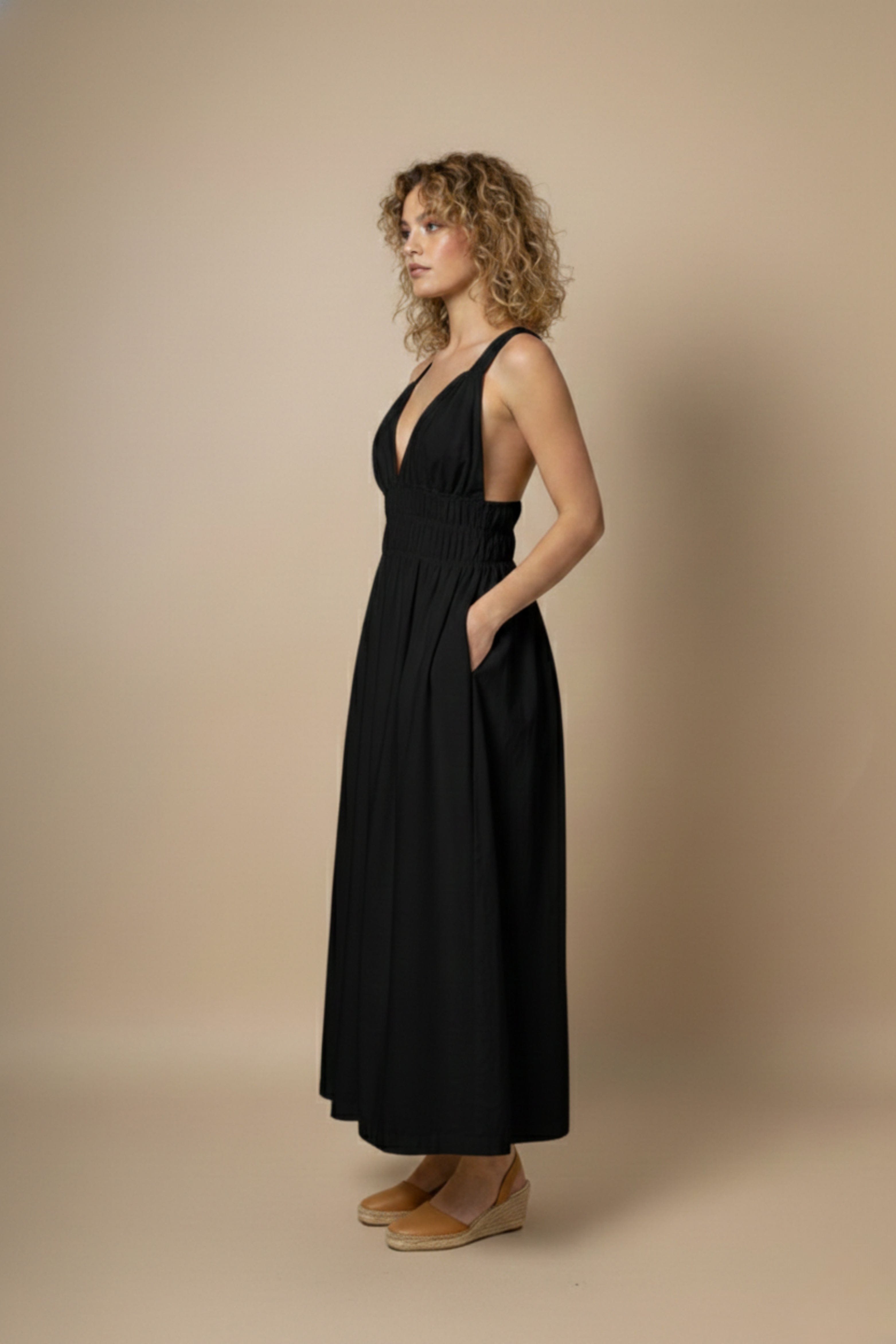 Black Doodlage August dress featuring a fitted silhouette and stylish design, displayed on a mannequin.