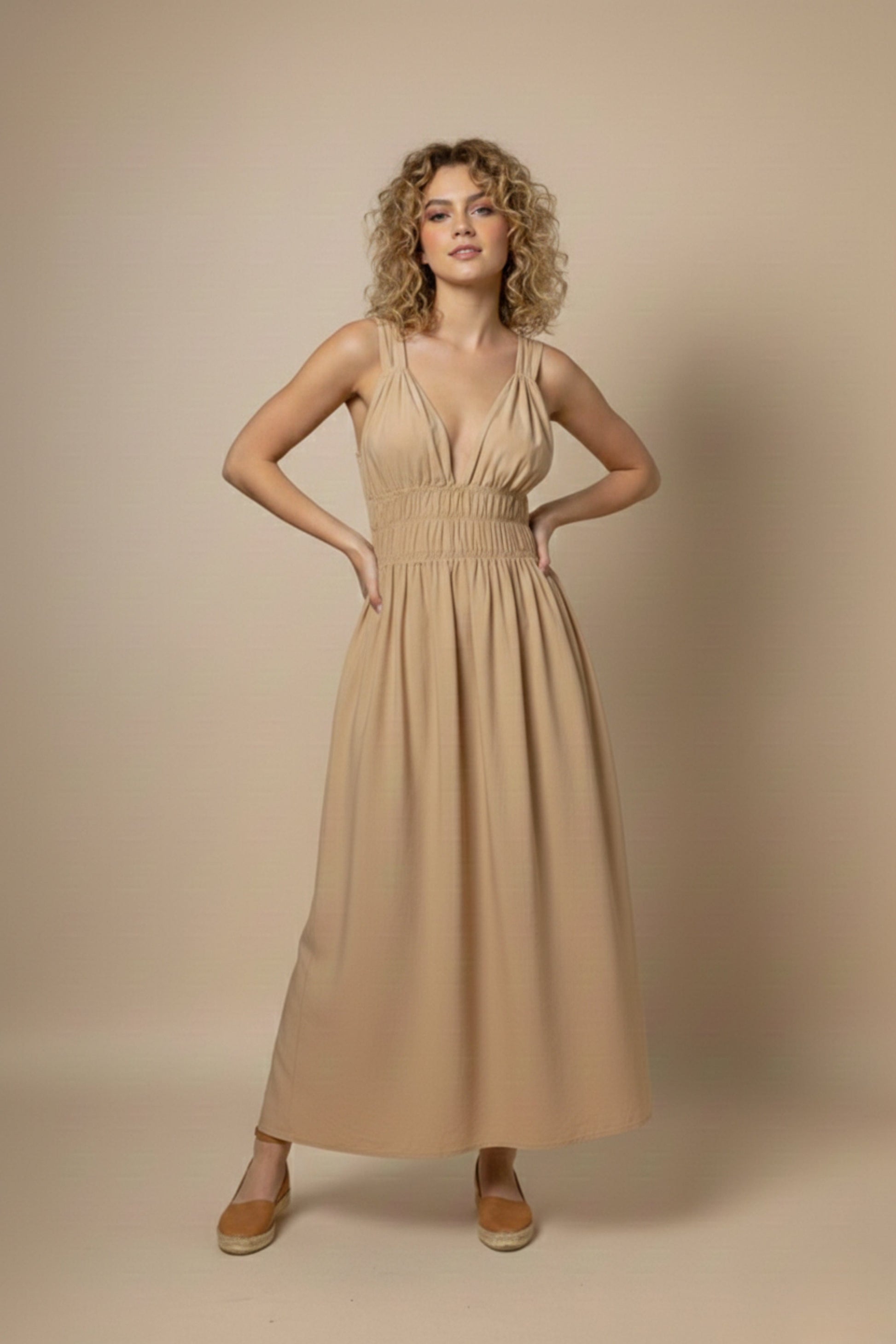 Doodlage August beige dress, lightweight and stylish, shown on a hanger with fabric details and neutral background.
