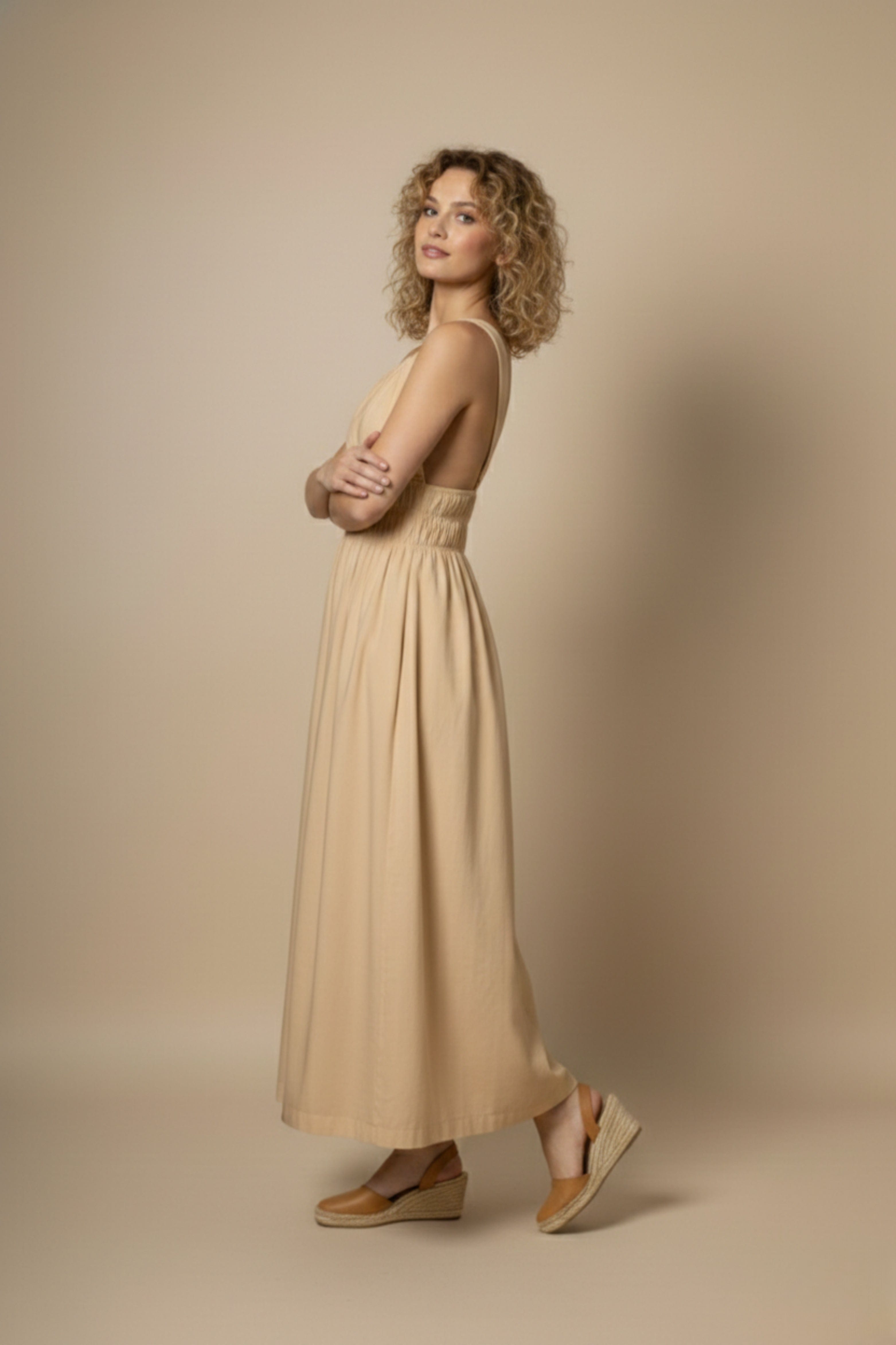 Beige Doodlage dress with a relaxed fit, lightweight fabric, and subtle detailing, perfect for casual or semi-formal wear.