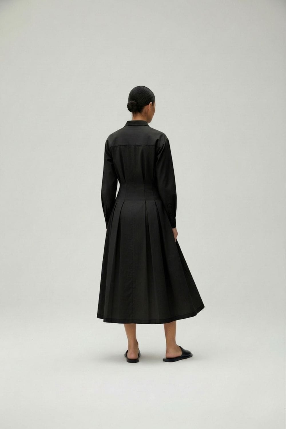 Black Cecile dress by Doodlage featuring a stylish, fitted design with subtle detailing and a classic silhouette.