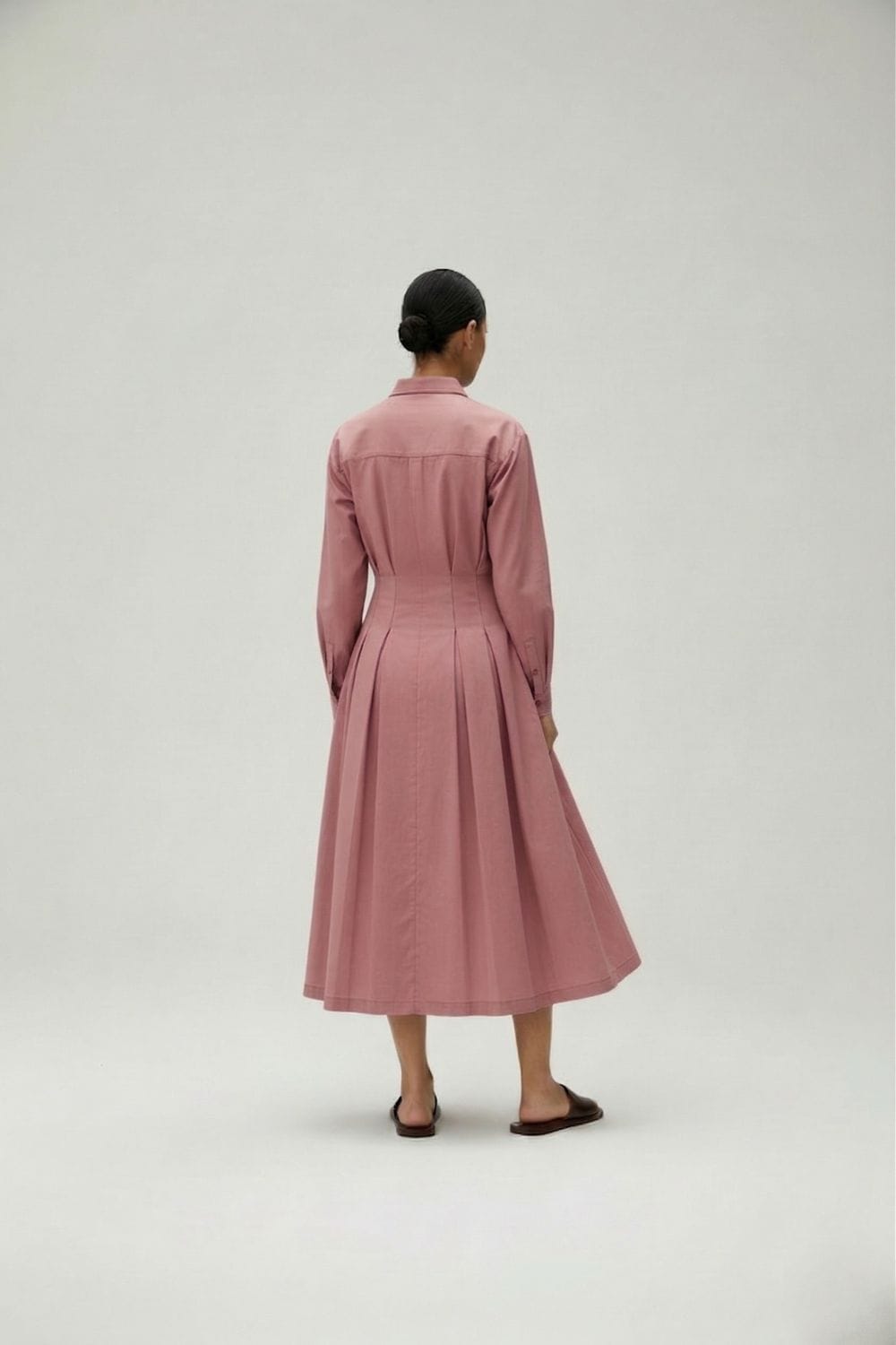 Doodlage Cecile pink dress with floral pattern, sleeveless design, and flowy fabric, displayed on a hanger.