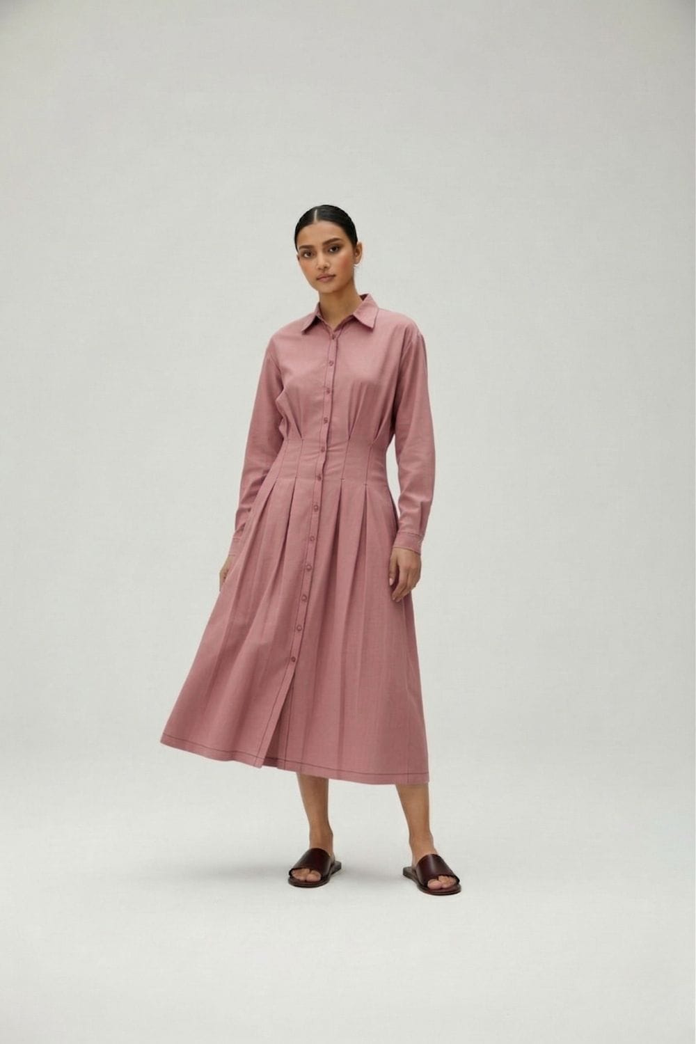 Doodlage Cecile pink dress with flowing fabric and elegant design, styled on a mannequin.