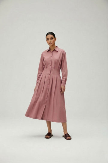 Doodlage Cecile pink dress with flowing fabric and elegant design, styled on a mannequin.