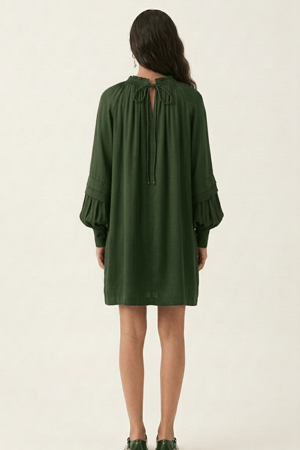 Doodlage Alice olive dress featuring a flowy silhouette and stylish design, shown on a model with a relaxed fit and elegant details.