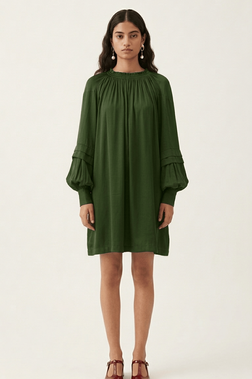 Doodlage Alice olive dress, knee-length with a relaxed fit and short sleeves, displayed on a hanger with a plain background.
