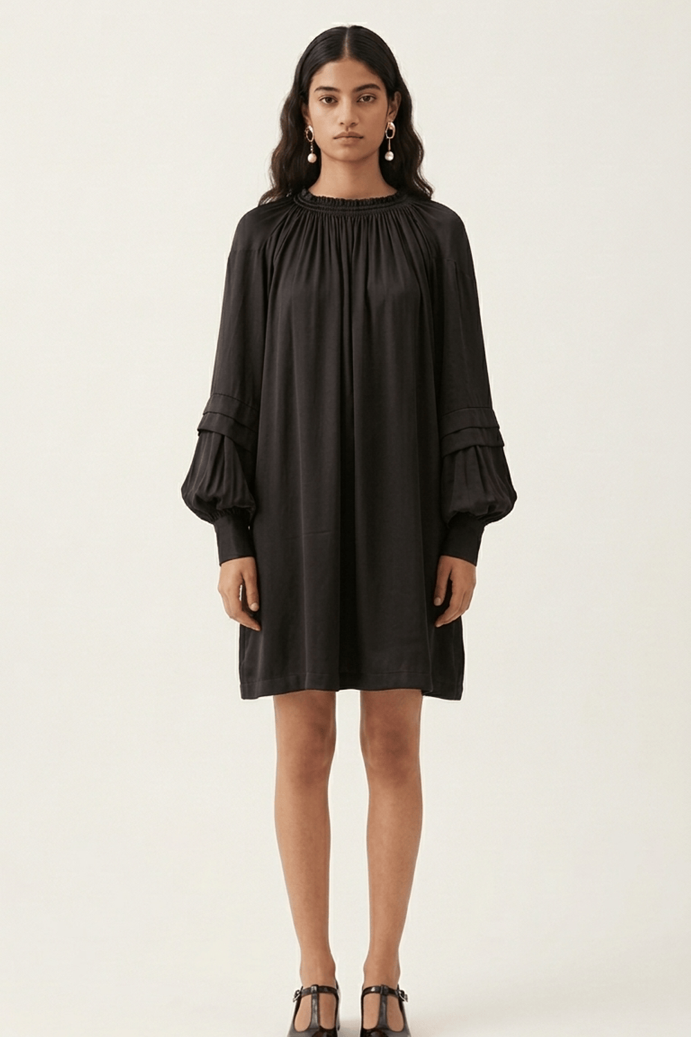 Black Alice dress by Doodlage featuring a stylish, fitted design with subtle detailing, perfect for casual or semi-formal wear.
