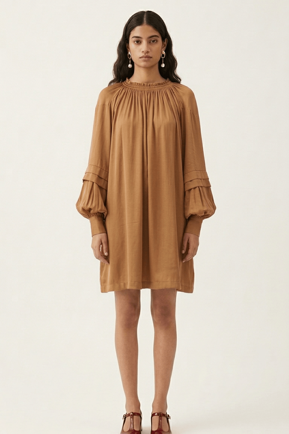 Doodlage Alice sand dress with flowy fabric and short sleeves, displayed on a hanger against a neutral background.