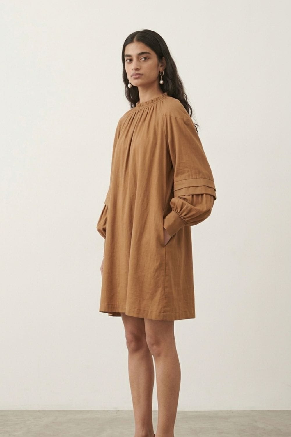 Doodlage Alice sand dress, lightweight flowy dress with a relaxed fit, shown on a model with neutral background.