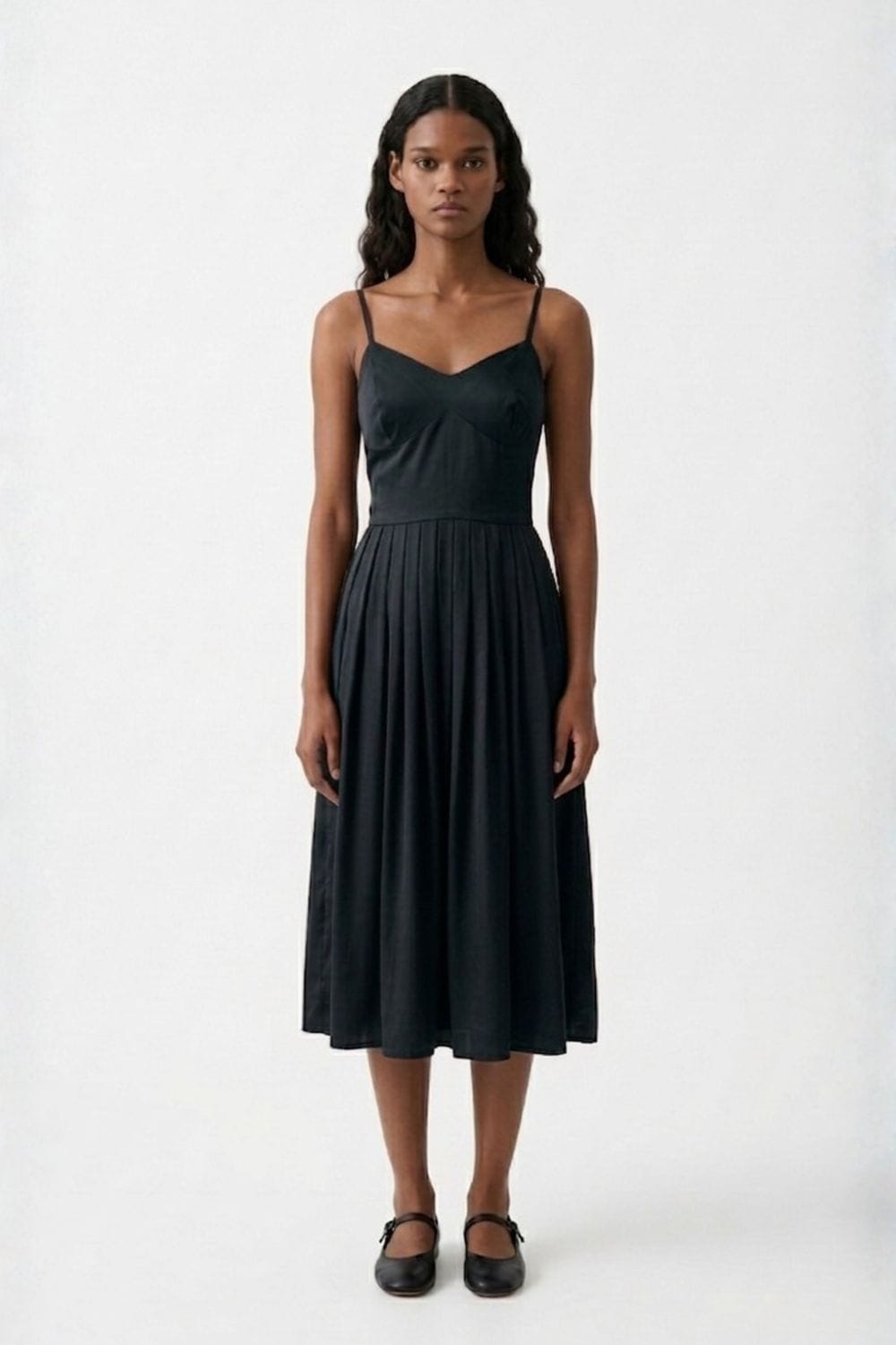 Black Doodlage Mary dress with long sleeves and a fitted silhouette, shown on a hanger against a plain background.
