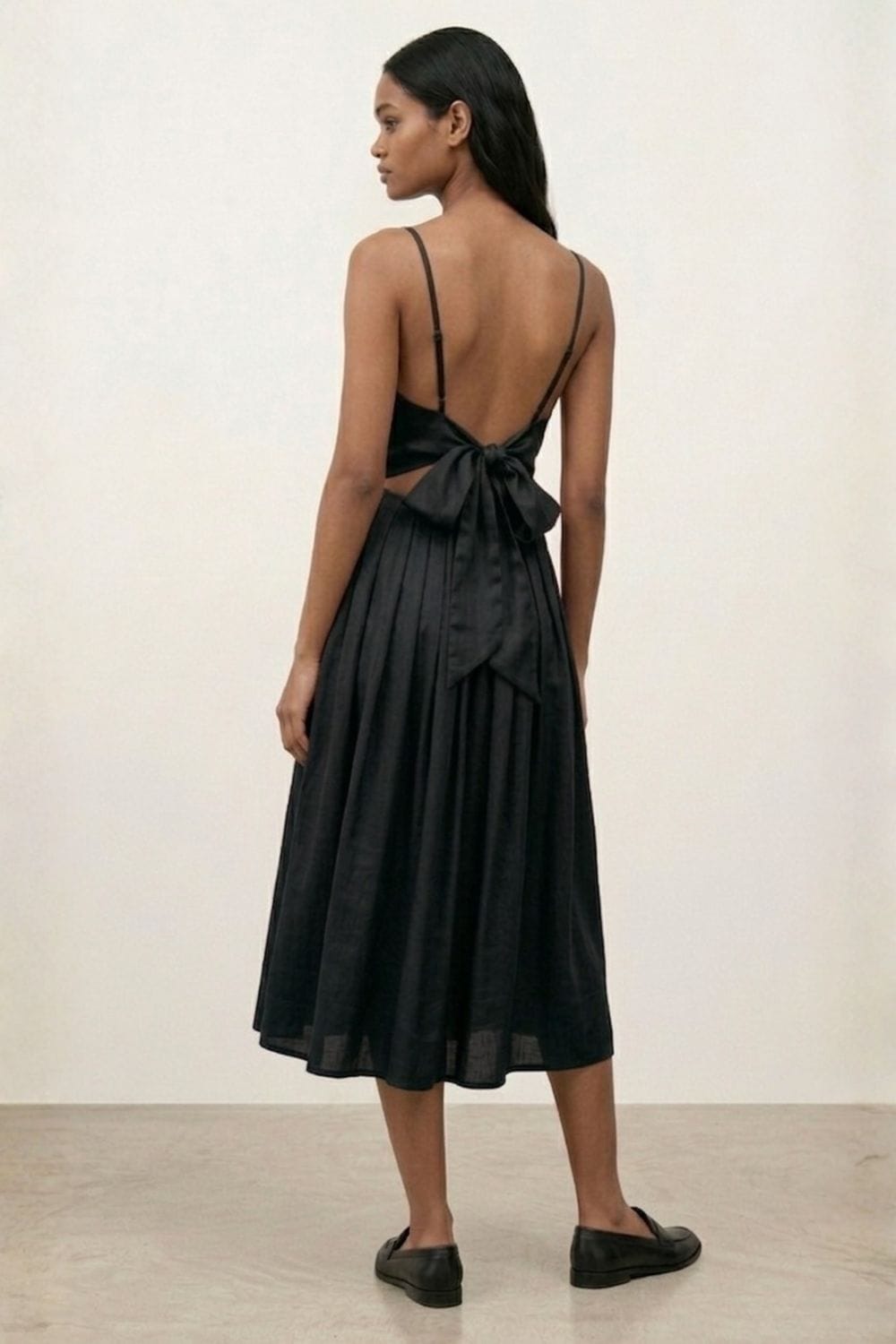Doodlage Mary black dress, stylish women's dress with elegant design, displayed on hanger in a well-lit setting.