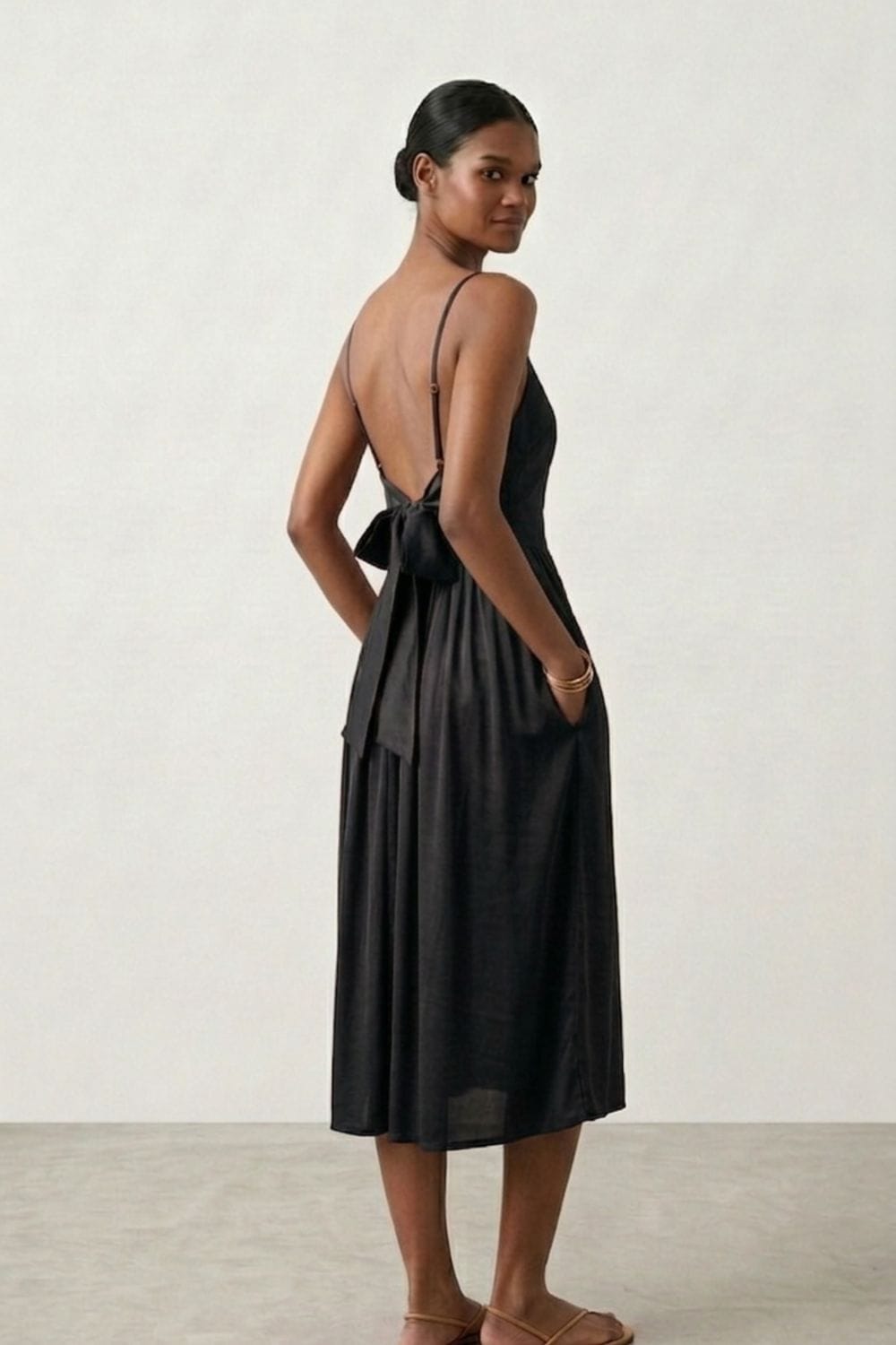 Black Doodlage Mary dress with long sleeves and a fitted silhouette, shown on a mannequin.